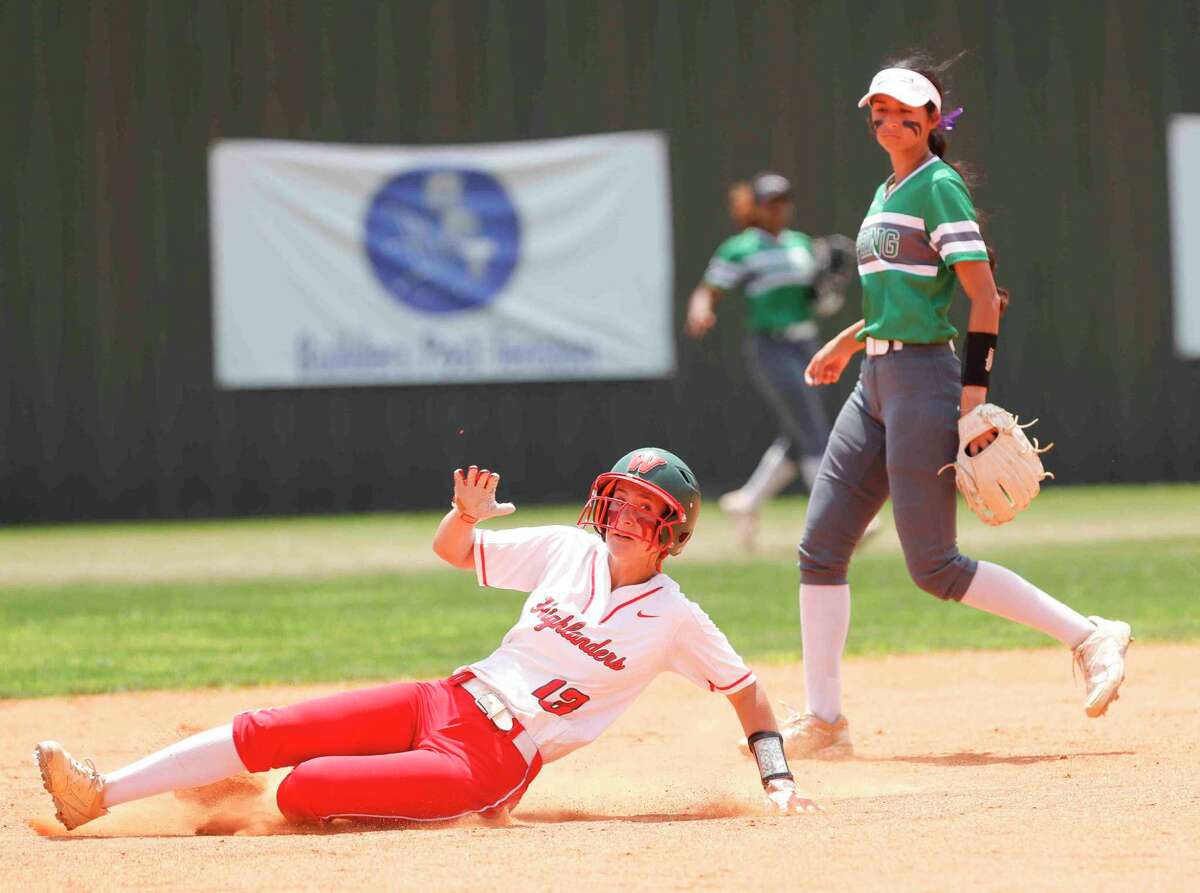 Mallory Suess #13 of The Woodlands steals second base in the first inning of Game 3 of a Regin II-6A bi-district high school softball series at The Woodlands High School, Saturday, April 30, 2022, in The Woodlands.