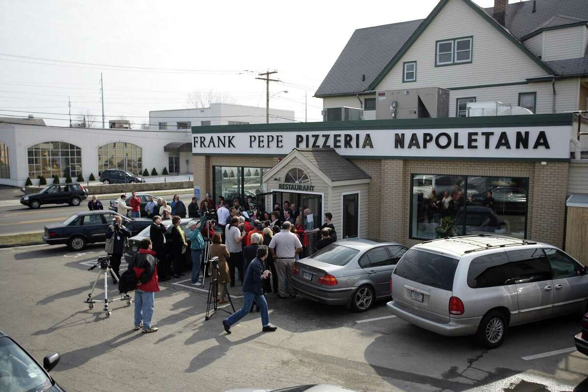 The crowd and media gather around the front entrance at Pepe's Fairfield for the grand opening ribbon cutting ceremony in 2006.