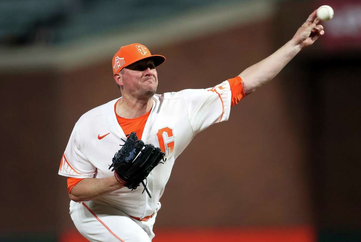 San Francisco Giants’ Jake McGee pitches in 9th inning of 9-2 win over Colorado Rockies during MLB game at Oracle Park in San Francisco, Calif., on Tuesday, May 10, 2022.