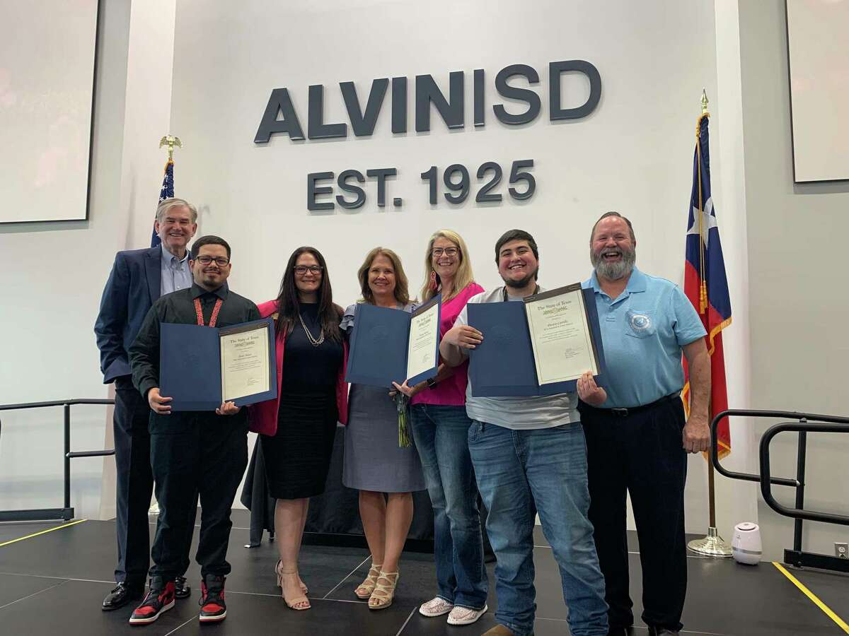 Alvin Independent School District administrators recognize three transportation employees April 22 for their rescue efforts after a collision Feb. 17 on Texas 6. From left are: State Rep. Ed Thompson, bus monitor Jesse Neace, trustee Nicole Tonini, Superintendent Carol Nelson, bus driver Tanya Moore, bus monitor Dustin Carrillo and trustee Earl Humbird.