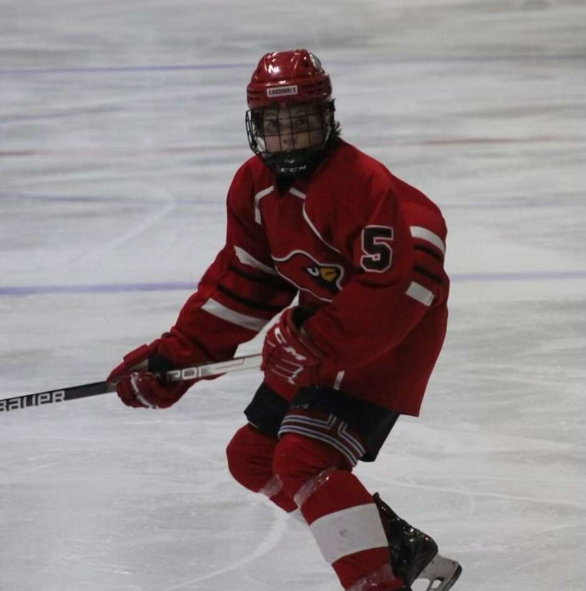 Brady Lisjak playing hockey after his right leg was lengthened 2.5 inches.