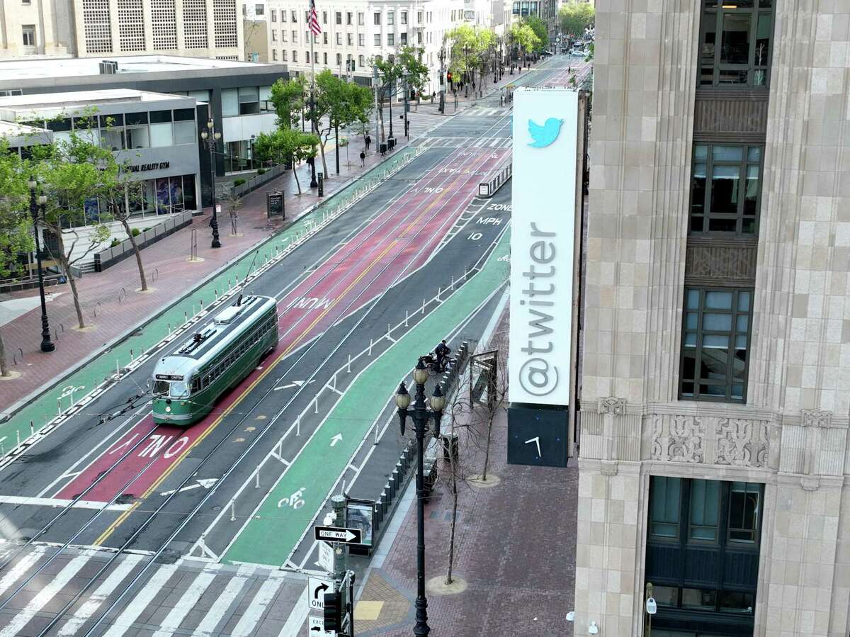 In an aerial view, a sign is seen posted on the exterior of Twitter headquarters on April 27, 2022 in San Francisco, California. Billionaire Elon Musk, CEO of Tesla and Space X, reached an agreement to purchase social media platform Twitter for $44 billion. (Photo by Justin Sullivan/Getty Images)