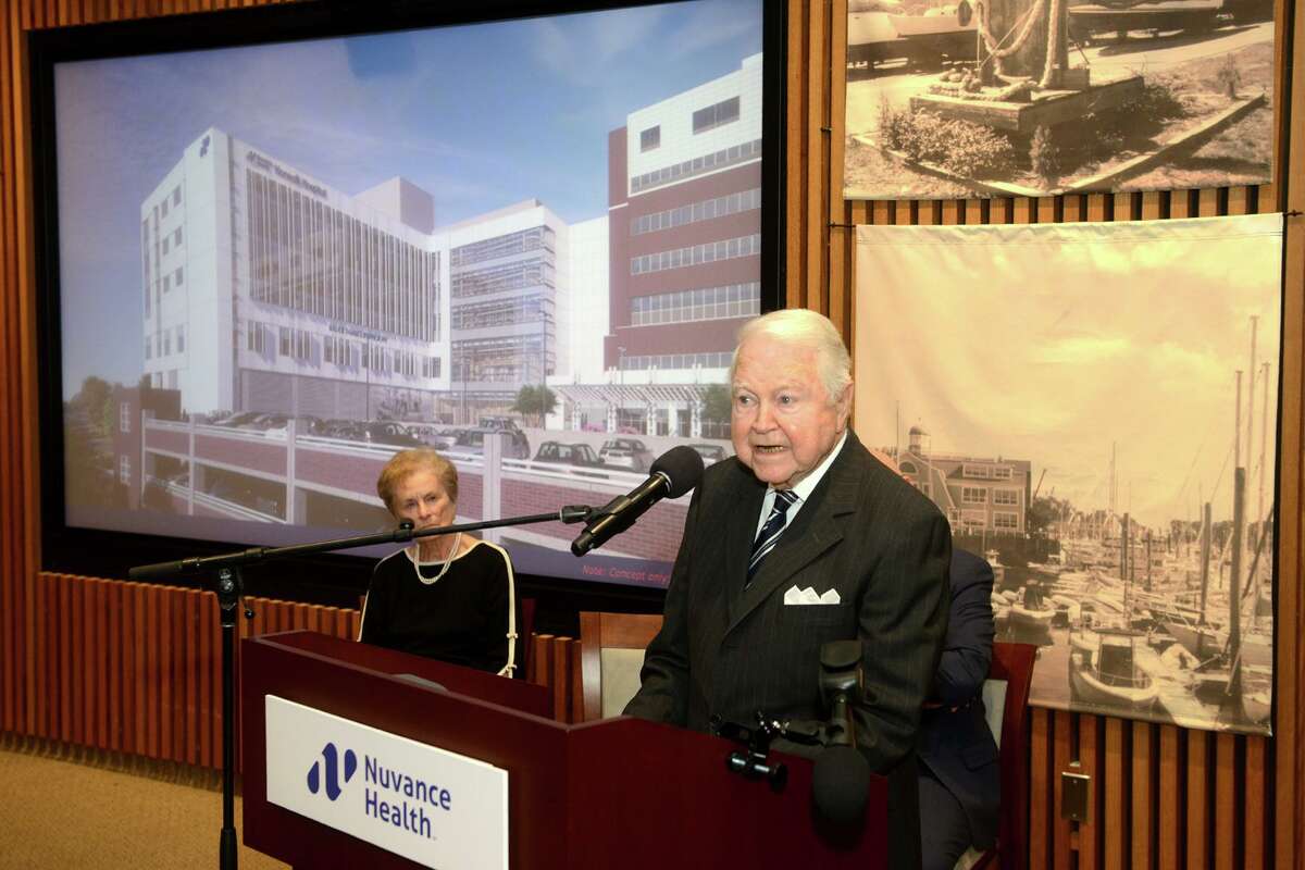 George Bauer speaks during a ceremony at Norwalk Hospital on Wednesday. Bauer and his wife, Carol, at left, are donating $20 million to the hospital to help in construction of a new 188,000-square-foot patient pavilion.