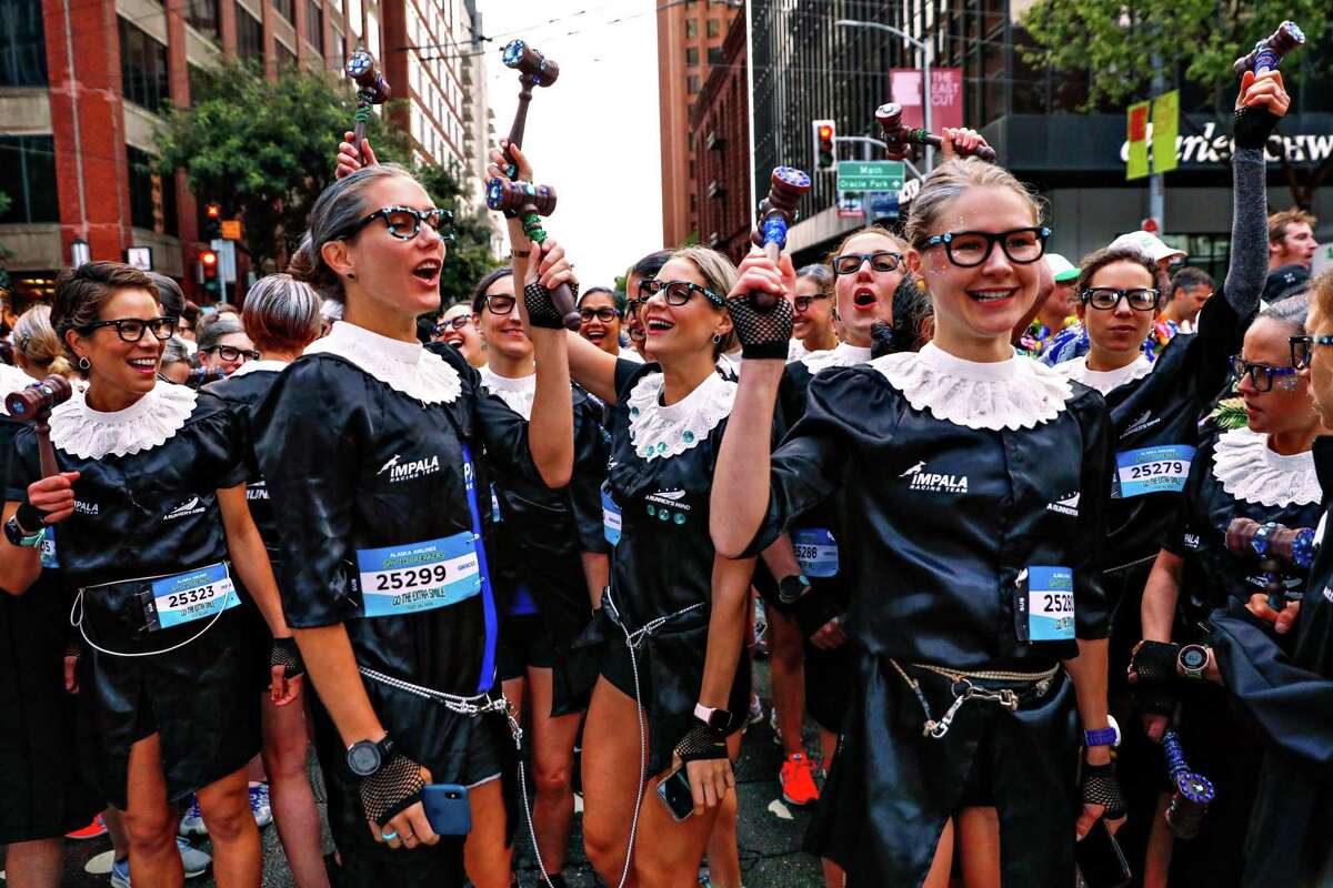 Women dressed as Supreme Court Justice Ruth Bader Ginsburg dance at the start of the Bay to Breakers race in San Francisco on May 19, 2019.