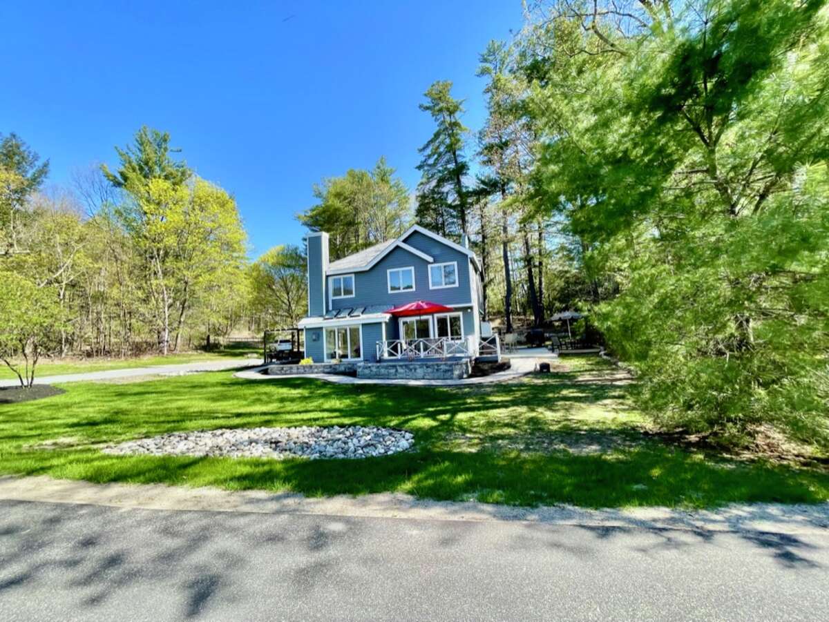 This week’s house is a Lake George getaway in Bolton. Located in Lagoon Manor, the house has three bedrooms, two and a half bathrooms and 2,149 square feet of living space. It was built in 1990. Owners of the house have access to a sandy beach along the Northwest Bay, a boat dock, clubhouse, heated pool, basketball and tennis courts. The floorplan makes use of the view with an open layout, large windows and skylights. There are gas fireplaces in the living room and primary bedroom. Luxury vinyl plank flooring, bar area with refrigerator and wine cooler. Public water and sewer. Bolton Central School. Quarterly HOA fee: $1,800. Taxes: $5,218. List price: $1,125,000. Contact listing agent James Casaccio of Premier Properties Lake George at 518-240-6142. 