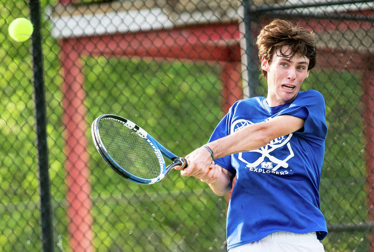 Stetson Isringhausen of Marquette makes a return shot during action against Alton Wednesday at Gordon Moore Park. Isringhausen defeated Parker Mayhew at No. 1 singles and was part of a winning doubles team with partner Thomas Wendle.