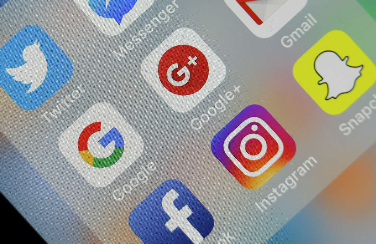 In this photo illustration, the social medias applications logos, Twitter, Google, Google+, Gmail, Facebook, Instagram and Snapchat are displayed on the screen of an Apple iPhone on Oct. 8, 2018 in Paris, France.