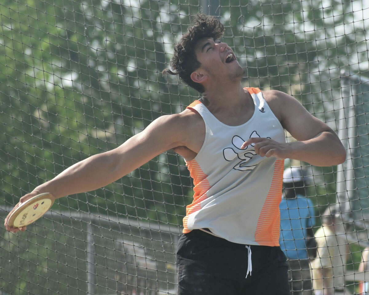 Edwardsville's Iose Epenesa competes in the discus during the Southwestern Conference Meet at the Winston Brown Track and Field Complex on Wednesday in Edwardsville.