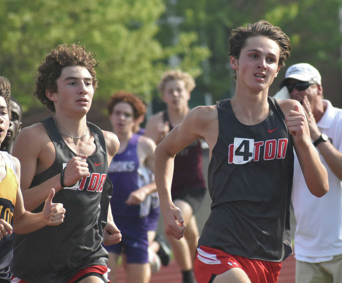 Johnathon Krafka, right, and Christian Kotzamanis compete in the 800-meter run for the Alton Redbirds at the Southwestern Conference Meet on Wednesday in Edwardsville.