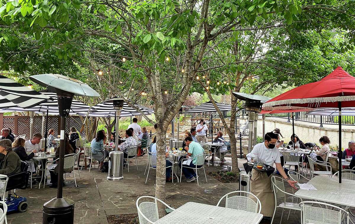 Customers dine on the patio at Jardín.