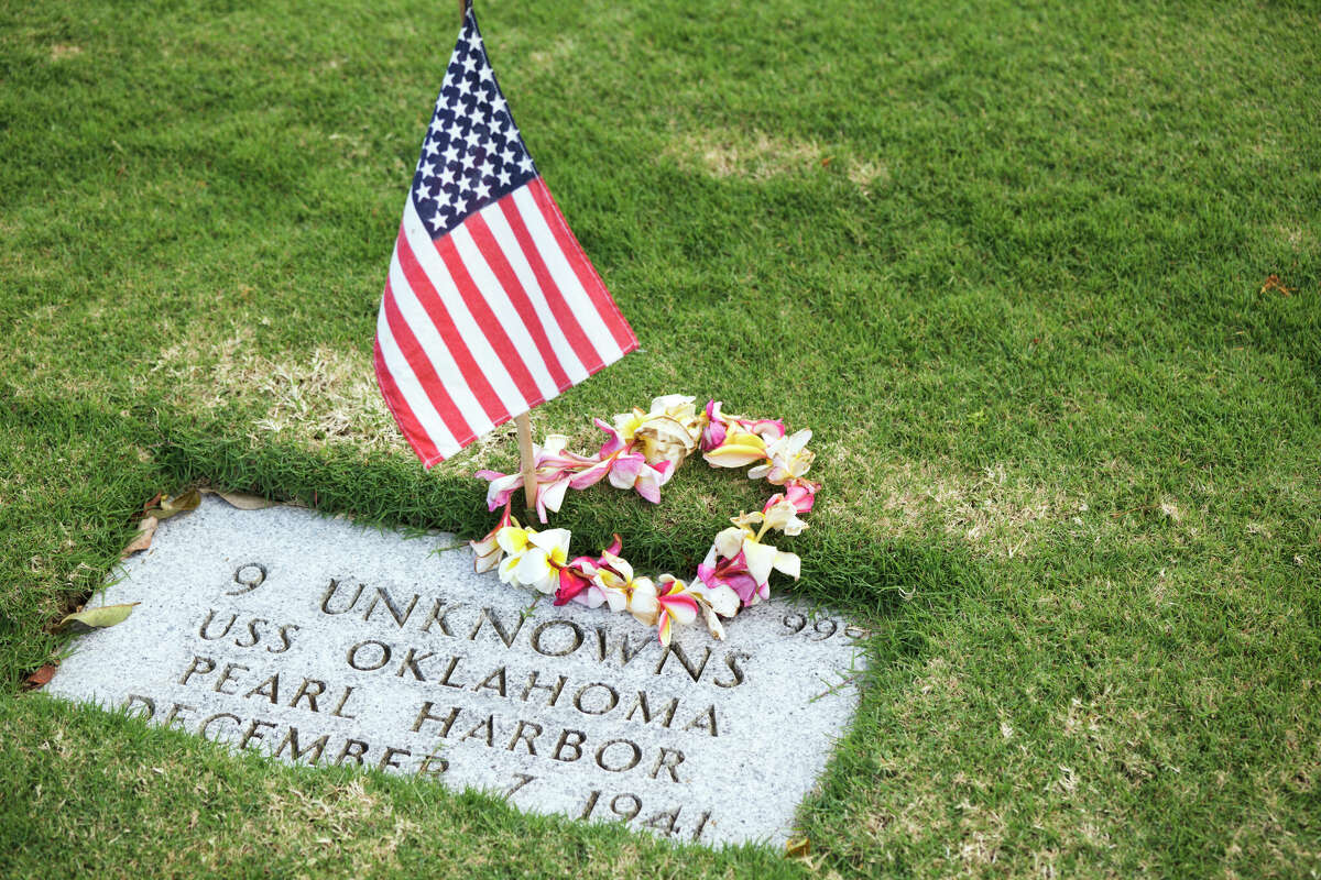 Memorial Day at a Punchbowl National Cemetery (aka National Memorial Cemetery of the Pacific) gravesite of 9 unknown people who died aboard the USS Oklahoma during the attack on Pearl Harbor on December 7, 1941.