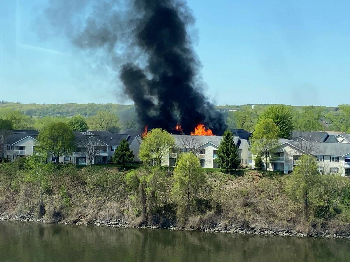 Troy Mayor Patrick Madden took this photograph Thursday from his office on the edge of the Hudson River as fire began to consume an apartment building on Starbuck Island.