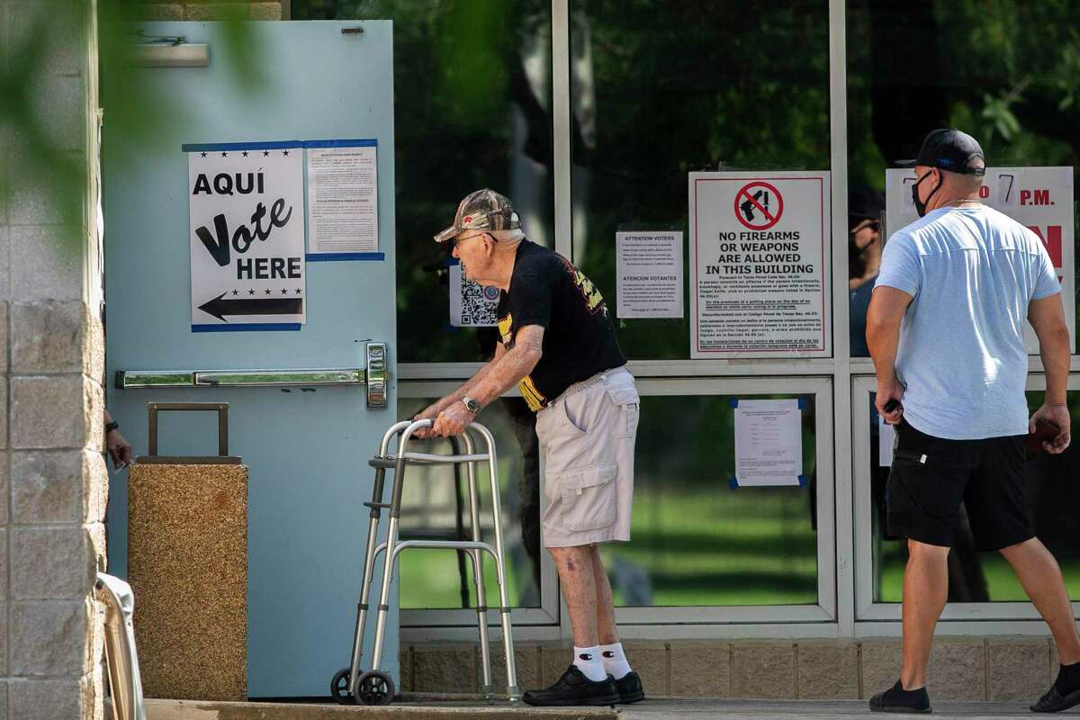 People line up to vote at Brook Hollow Library in San Antonio, Texas, on May 7, 2022. People voted on the city's bond package, two state propositions on property taxes, school district seats and/or bonds and suburban elections.