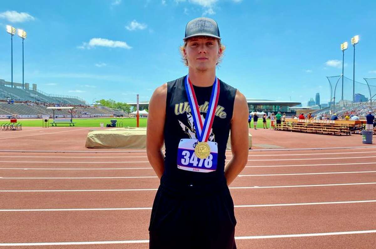 Woodville senior Linus Mannino stands with his gold medal at Mike A. Myers Stadium in Austin.