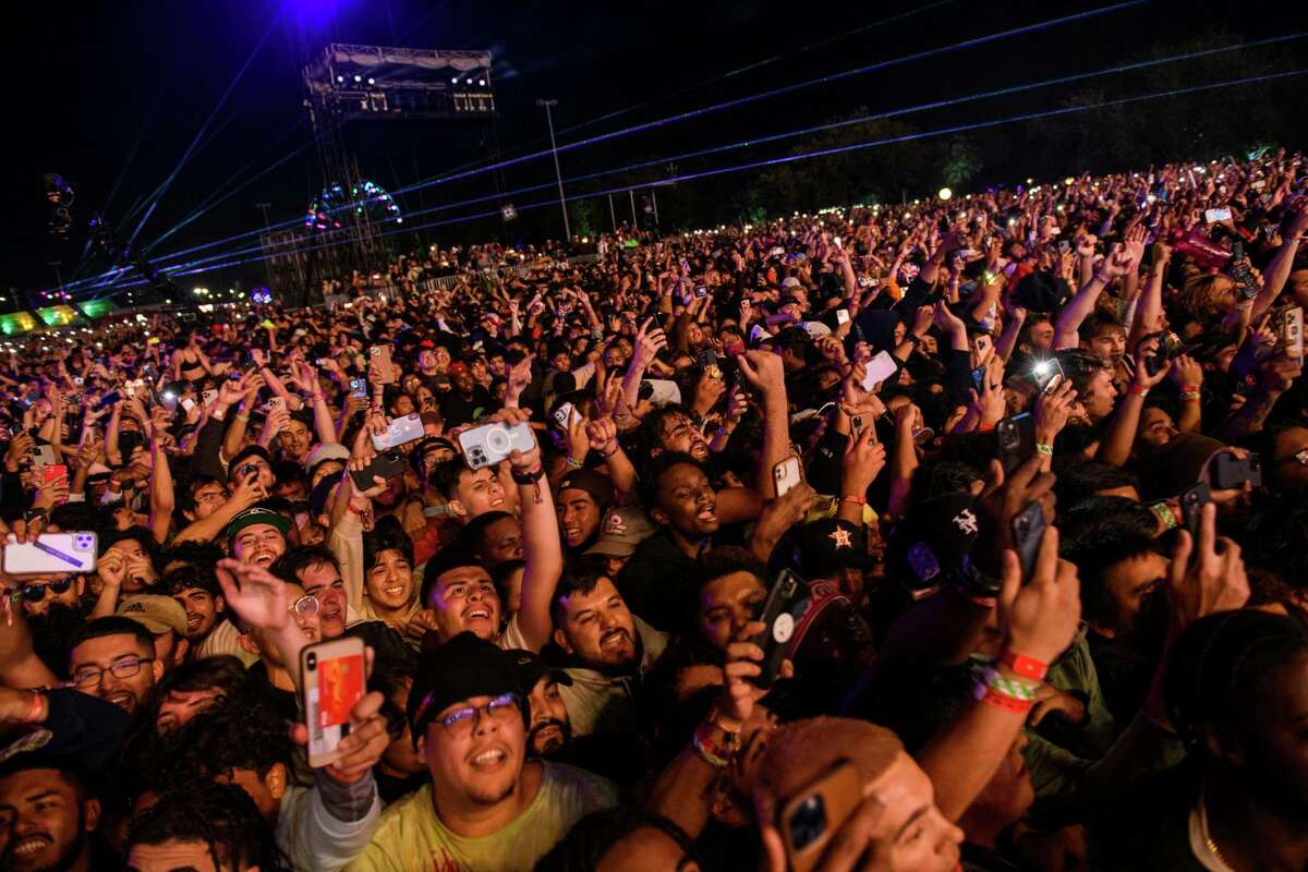 The crowd watches as Travis Scott performs at Astroworld Festival at NRG park on Friday, Nov. 5, 2021. Several people died and numerous others were injured in what officials described as a surge of the crowd at the music festival while Scott was performing. Officials declared a “mass casualty incident” just after 9 p.m. Friday during the festival where an estimated 50,000 people were in attendance, Houston Fire Chief Samuel Peña told reporters at a news conference. (Jamaal Ellis/Houston Chronicle via AP)