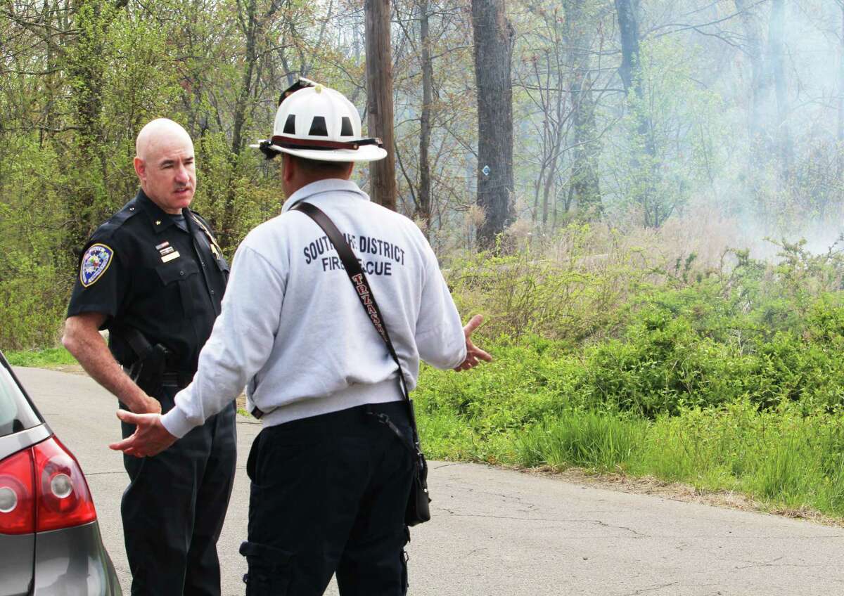 Land off Freeman Road in Middletown continues to burn Wednesday morning. State officials say the blaze, near the Higganum line, is of a suspicious nature, and likely separate from the fire that 100 firefighters battled off Aircraft Road Tuesday night, where hot spots are still burning.