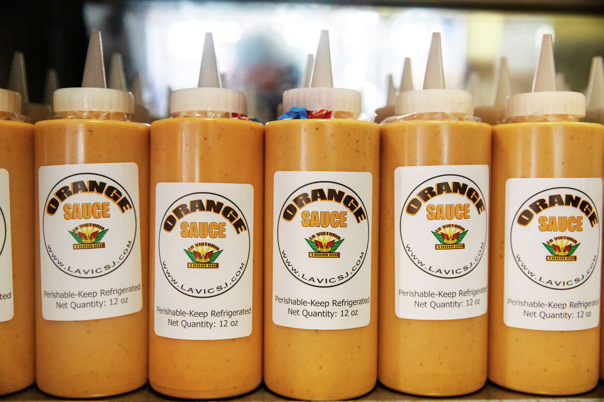 Bottles of La Victoria Taqueria orange sauce are available for sale at its San Jose, California restaurant on May 10, 2022.