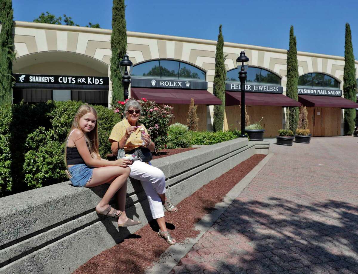 A woman and her niece enjoy ice cream from Baskin Robbins in a small shopping center near Bishop Ranch in San Ramon, Calif., on Tuesday, June 16, 2020. San Ramon was one of the few California small cities among the top 50 “most livable” the U.S. in 2022, according to a report from SmartAsset.