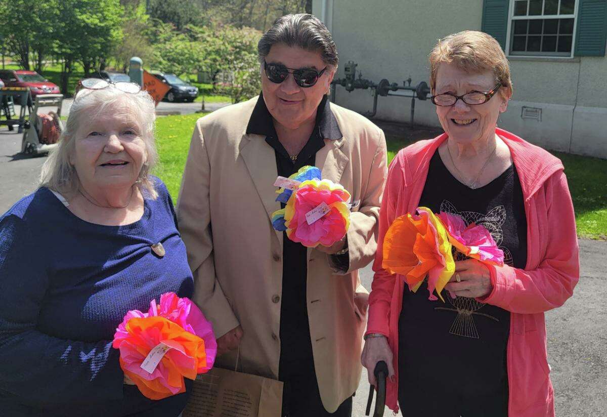 Kids from the Homework Club at Community Centers Inc. restored a tradition of making flowers for Greenwich’s seniors for Mother’s Day. From left, Elaine Marciniak, Gene Santini and Barbara Jones all received some of the handmade flowers.