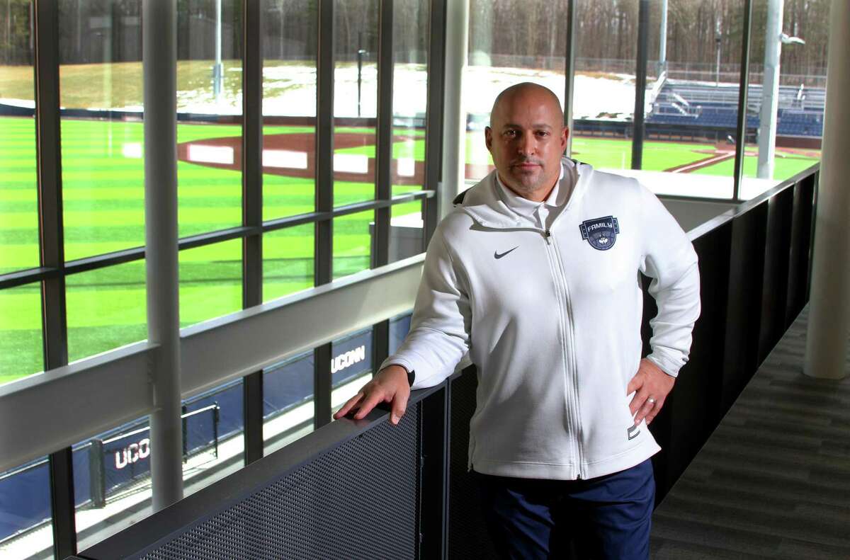 UConn Athletic Director David Benedict, poses inside the new Rizza Performance Center on the campus in Storrs, Conn., on Thursday Mar. 4, 2021. In the background is Elliot Ballpark.