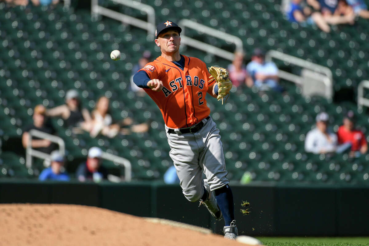 Houston Astros third baseman Alex Bregman throws to get Minnesota Twins Max Kepler out at first during the third inning of a baseball game, Thursday, May 12, 2022, in Minneapolis. (AP Photo/Craig Lassig)