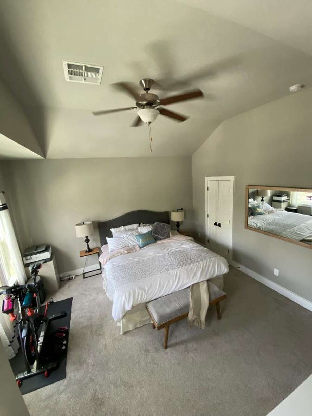 This bedroom on the second floor is only made bigger by the tall ceilings.