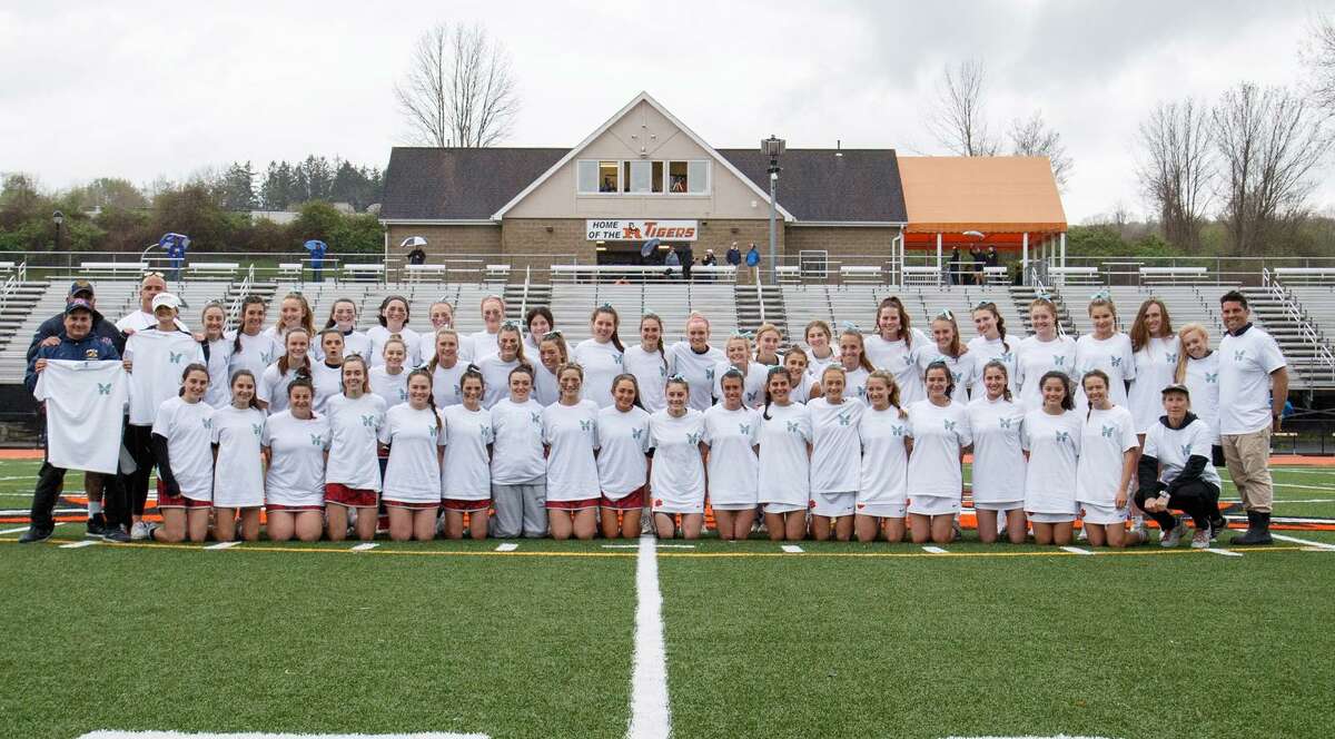 Members of the Ridgefield and New Fairfield girls lacrosse teams competed in a dedication game for Morgan's Message, which strives to eliminate the stigma surrounding mental health within the student-athlete community and equalize the treatment of physical and mental health in athletics.