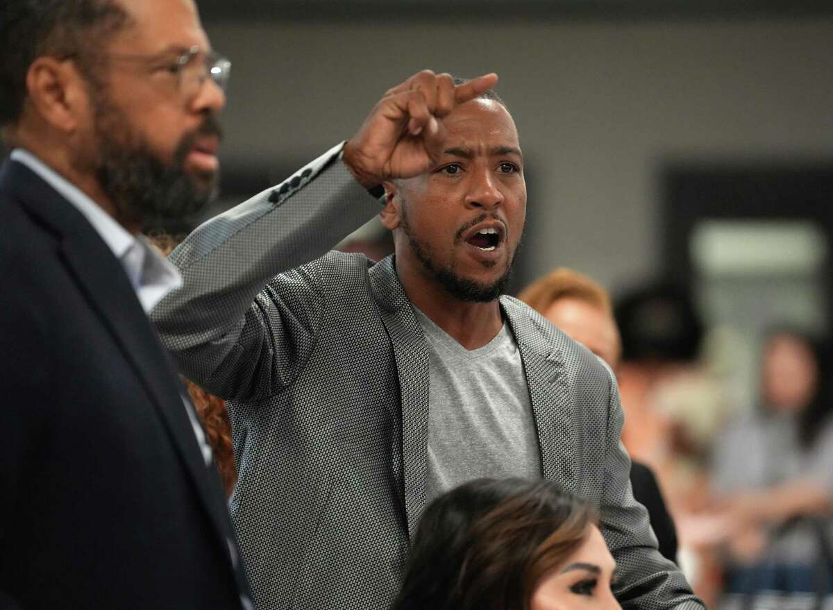 Kevin Wright, a property owner in Third Ward, gets into a heated shouting match and was eventually escorted out during a meeting with residents of Riverside Terrace in Third Ward as they denounced the proposed Riverside Terrace Historic District at Good Hope Missionary Baptist Church on May 12, 2022, in Houston. They say a minority of homeowners sought the historic district status and that it would be onerous for longtime owners, who cannot meet the historic specifications for repairs and upkeep and will force families who have been in the area for generations to live in homes they cannot afford to repair or sell all together. They say there was never a public meeting. “This is not preservation. The federal and state tax breaks for homes in a historic district are more favorable for investors than longstanding primary residents.