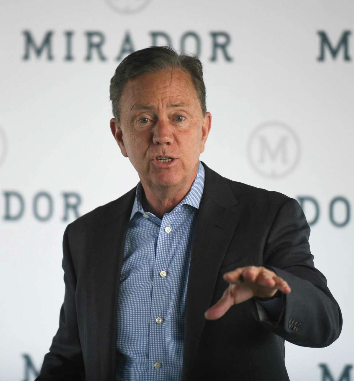 Connecticut Gov. Ned Lamont speaks at a press conference at the future headquarters of Mirador in Stamford, Conn. Monday, April 25, 2022.