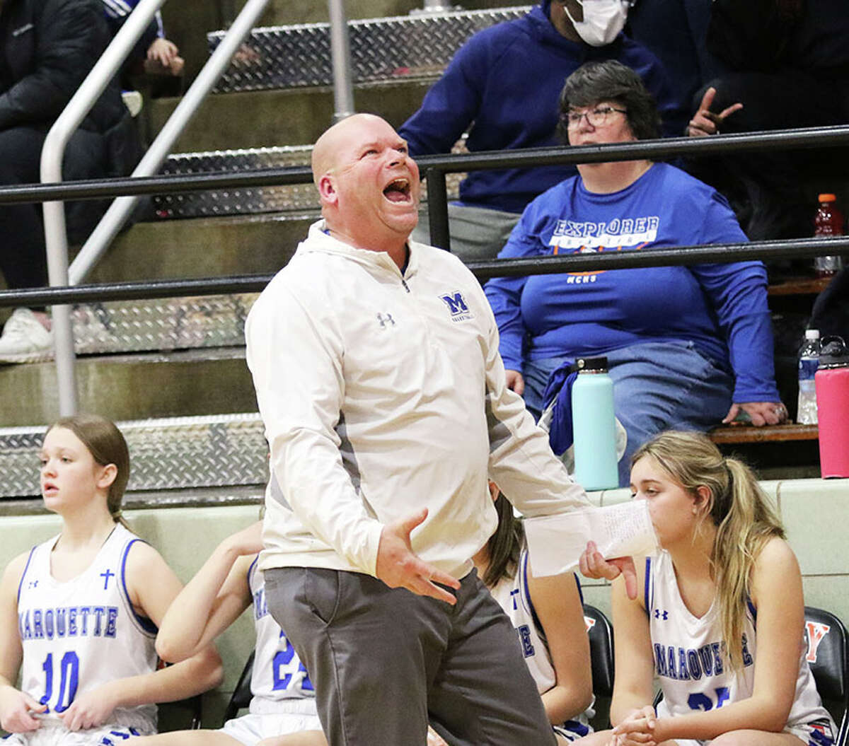 Marquette Catholic girls basketball coach Lee Green reacts to a call during his teams Class 2A Sectional sectional victory last season in Waverly. After six seasons and a 114-51 record at Marquette, Green has been hired as boys basketball coach at CM.  