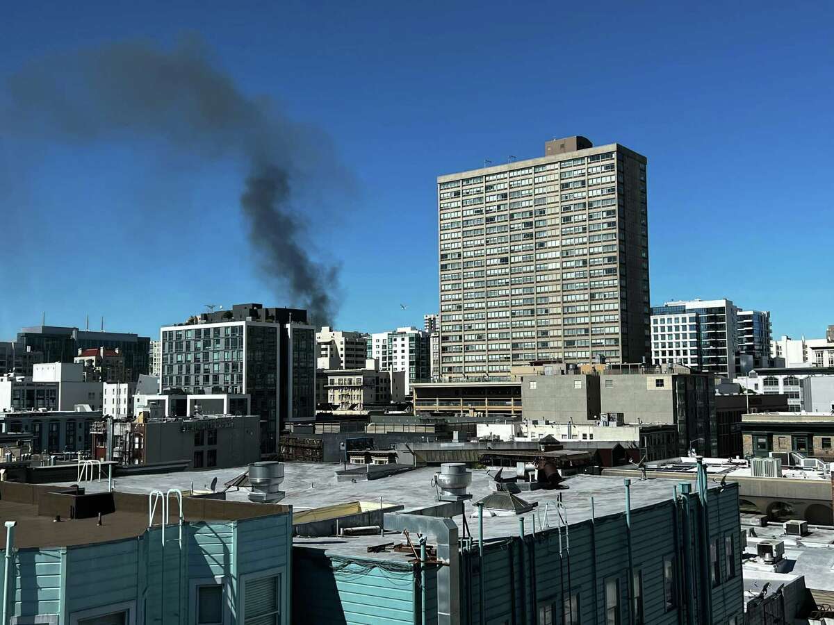 A column of smoke seen burning from a fire on Ellis Street in San Francisco, Calif. Firefighters said multiple rescues were underway shortly after the fire was reported.