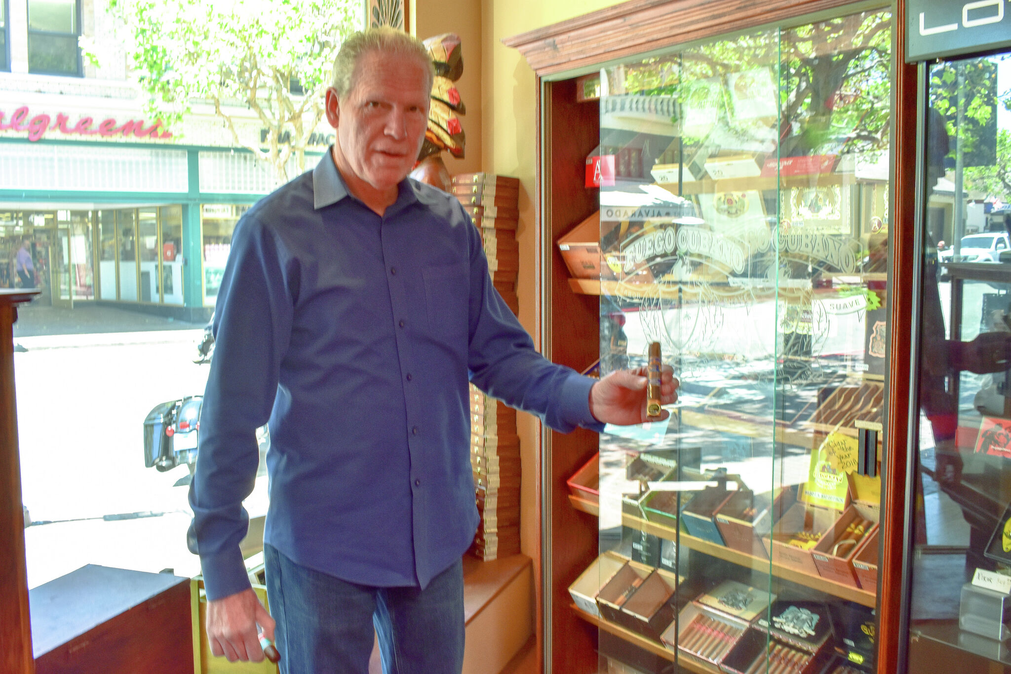 Behind the counter at Hellam's, the oldest tobacco store in California