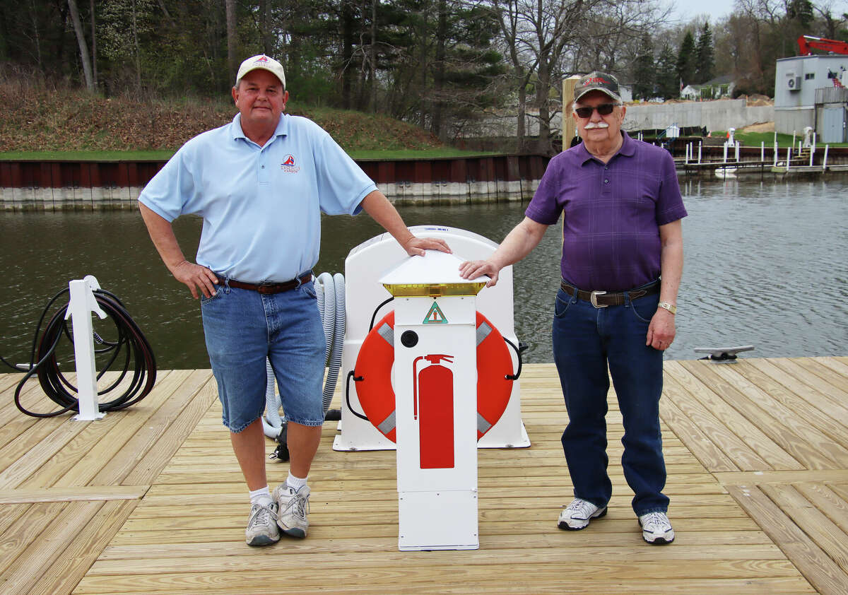 Almost $900,000 in improvements to the Caseville Marina, including new safety features, fuel pumps and an ADA-compliant ramp to the docks, will be finished and ready just in time for summer. Above, Caseville Harbor Master Steve Louwers, left and Caseville Harbor Commission chairman Jerry Wroblewski stand next to one of the marina's new safety stations, paid for largely by a grant from the Michigan Department of Natural Resources.