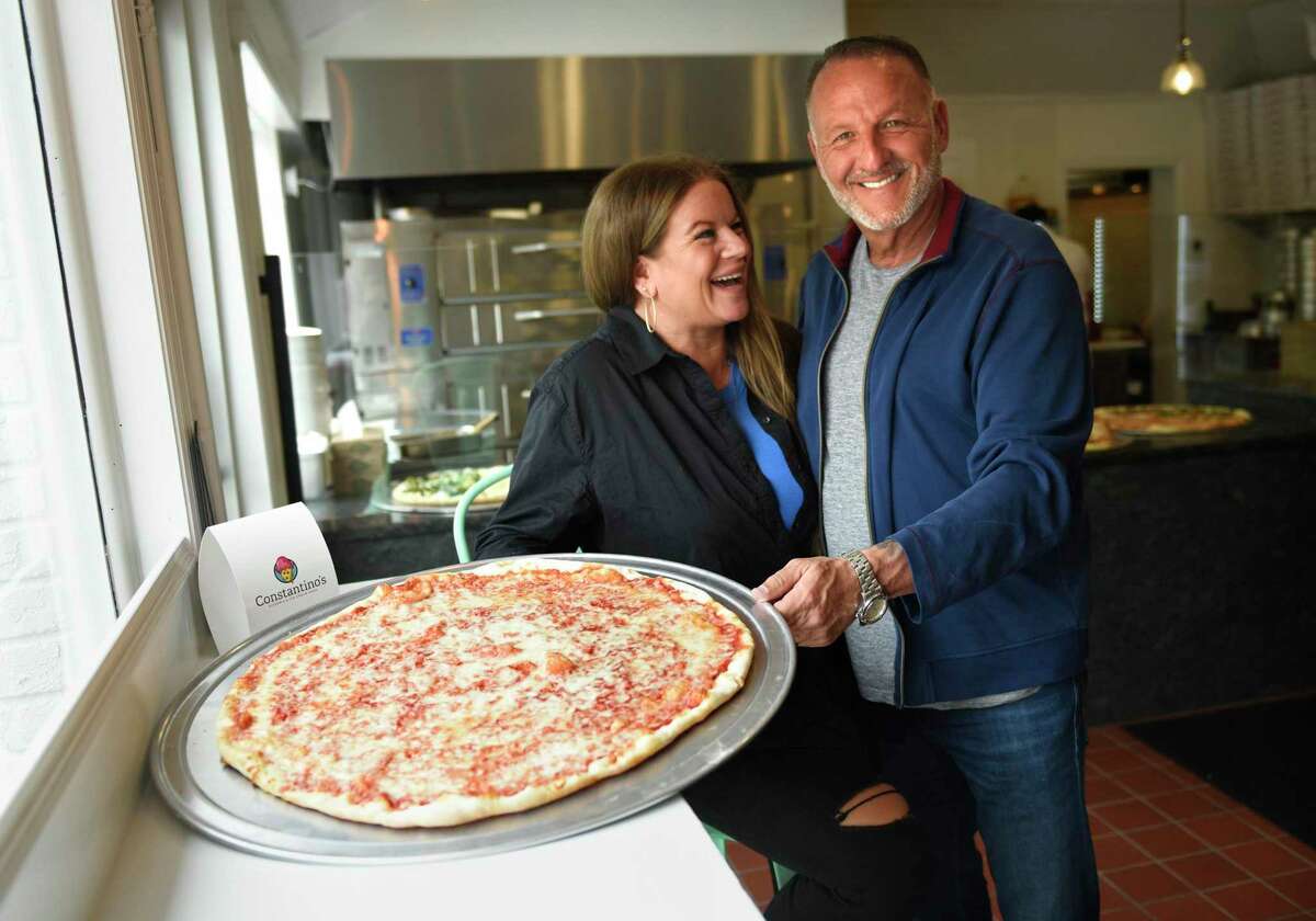 Owners Robyn and Michael Bordes pose at Constantino's pizza and ice cream restaurant in Greenwich, Conn. Thursday, May 12, 2022. Robyn and Michael Bordes recently opened the restaurant at the location of the former Stateline Deli at 699 W. Putnam Ave.