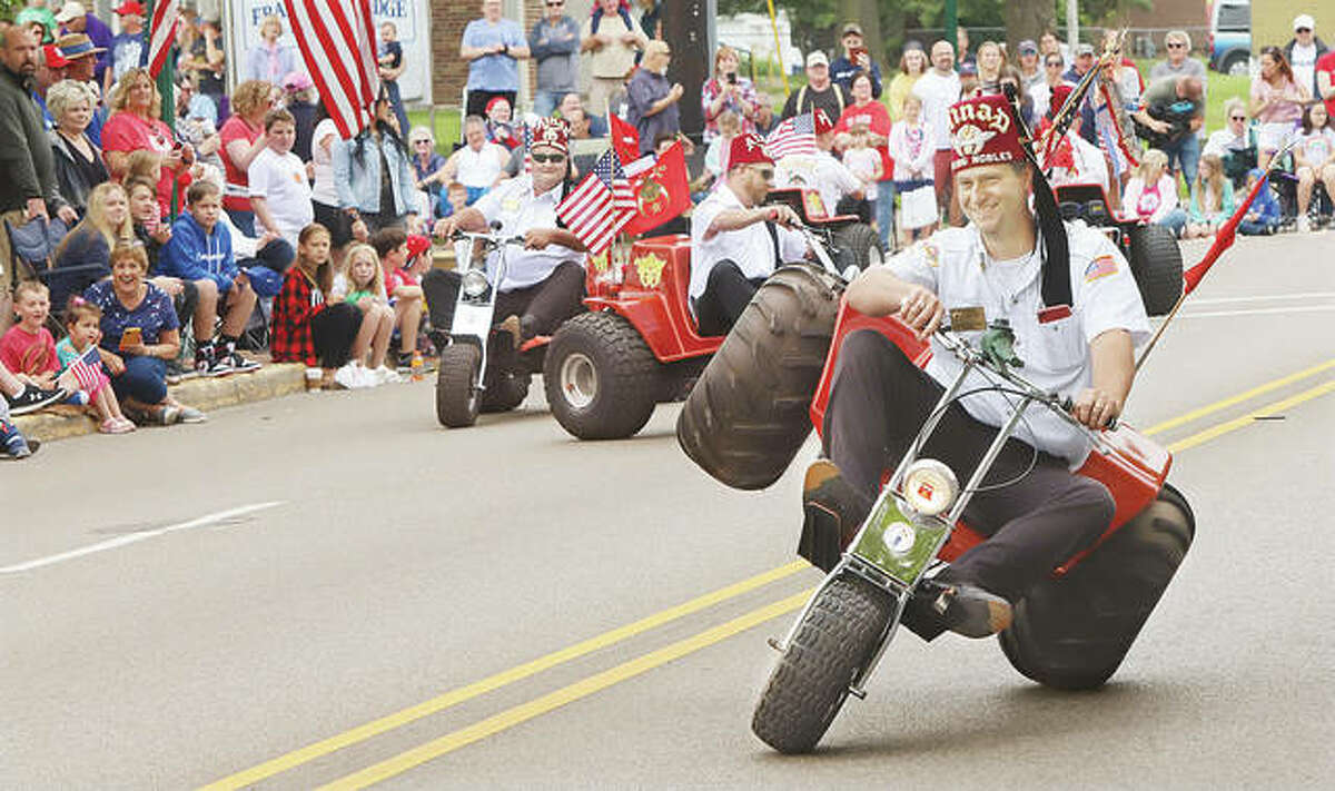 The crowd pleasing Ainad Rolling Nobles on their three-wheelers during last year's Memorial Day Parade in Alton. The 155th version of the parade is set for Monday, May 30, starting at 10 a.m.