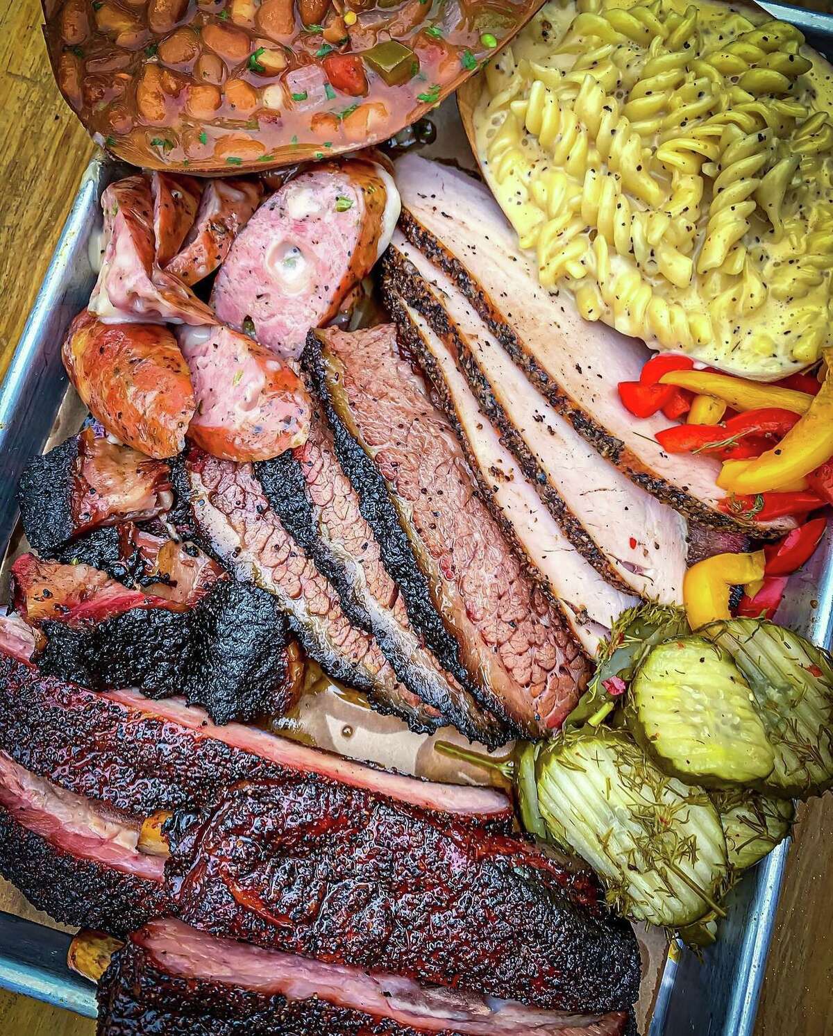 A variety of barbecue meats and sides from 2M Smokehouse.