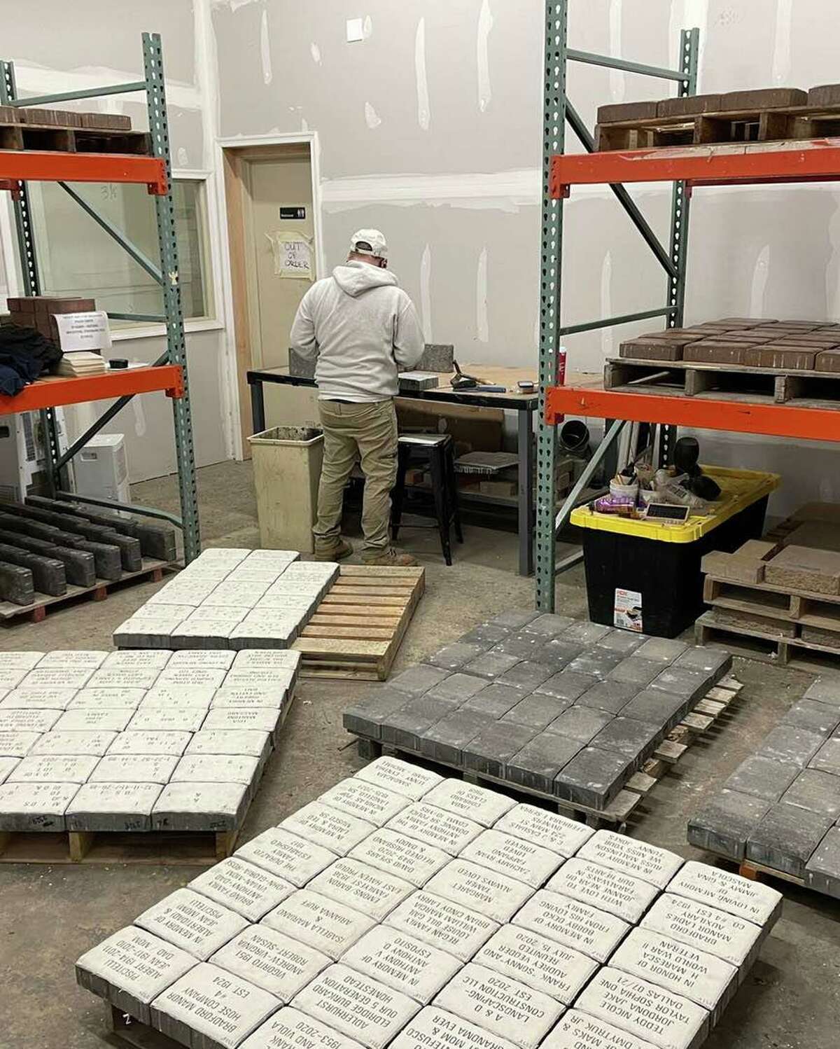 Engraved bricks, purchased by town residents as part of the Town Green Beautification project in East Haven, are being manufactured in New Jersey by PaverArts.