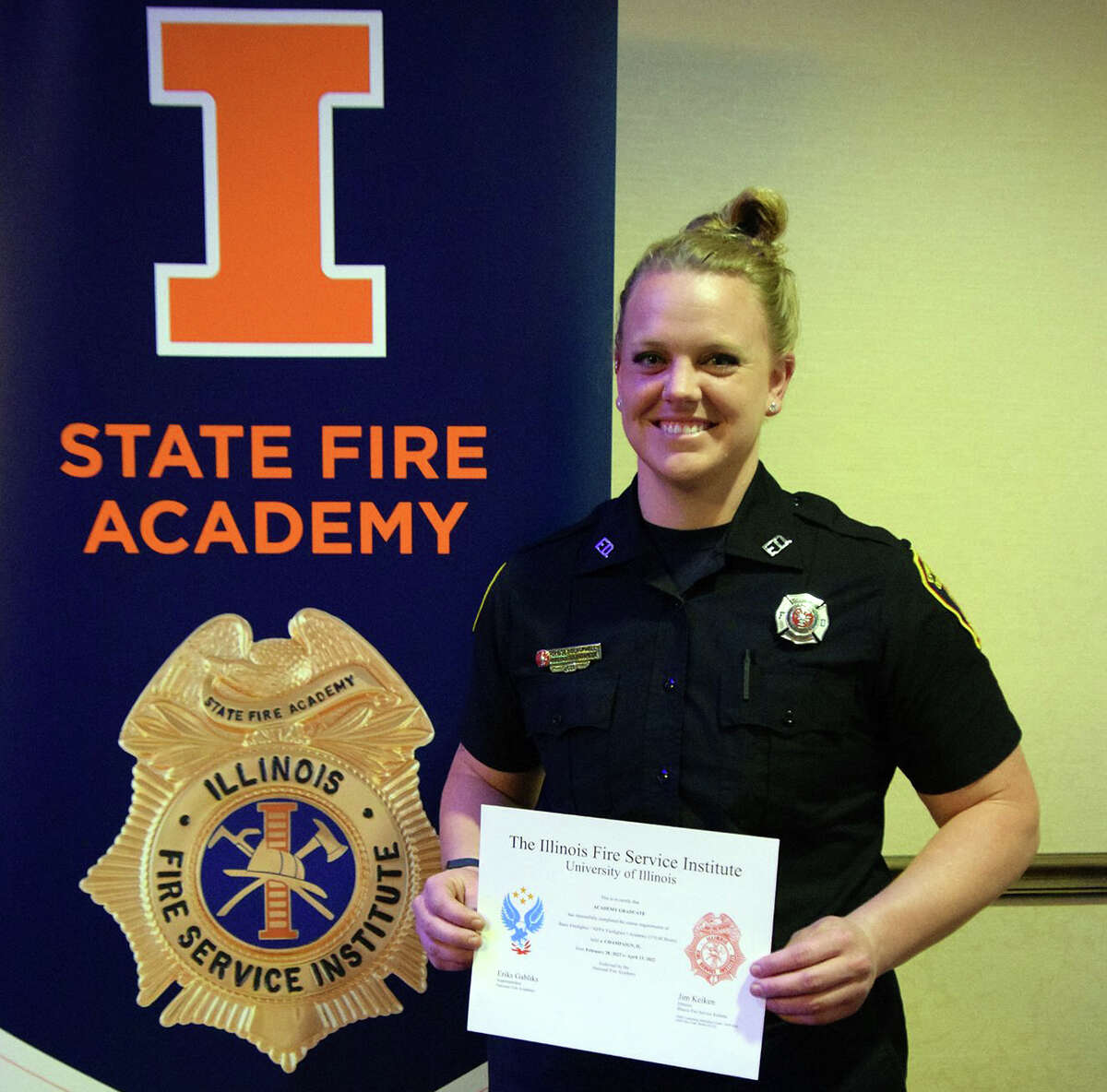 Recent Edwardsville Fire Department hire Lindsey Blackwell, shows off her certificate from the state fire academy in Champaign. She is the department's second female hire.