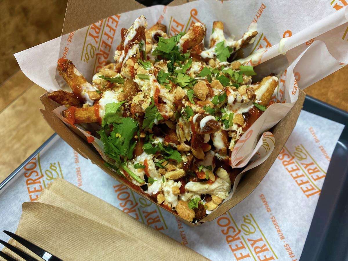 Fusion fries from Jefferson Fry Co. with grilled chicken, hoisin, sriracha, crushed peanuts and cilantro.?