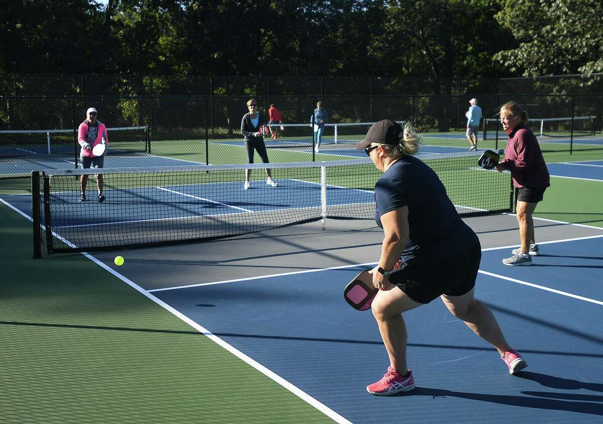 Pickleball enthusiasts enjoy a morning game at Unity Park in Trumbull, Conn. on Tuesday, September 29, 2021.