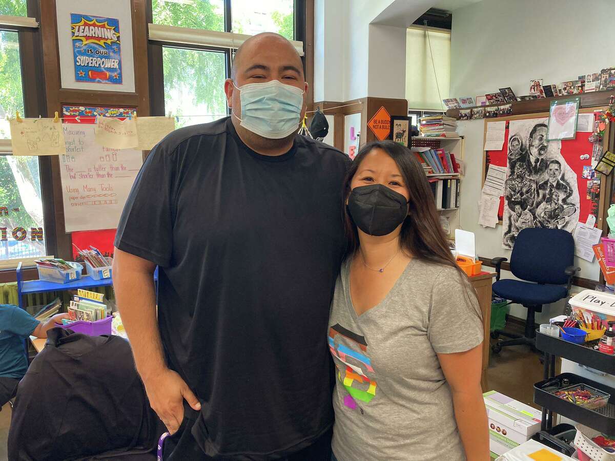 Vincent Reyes (left) and Cecily Ina, two San Francisco teachers who entered a burning building to help rescue people inside in San Francisco, Calif.