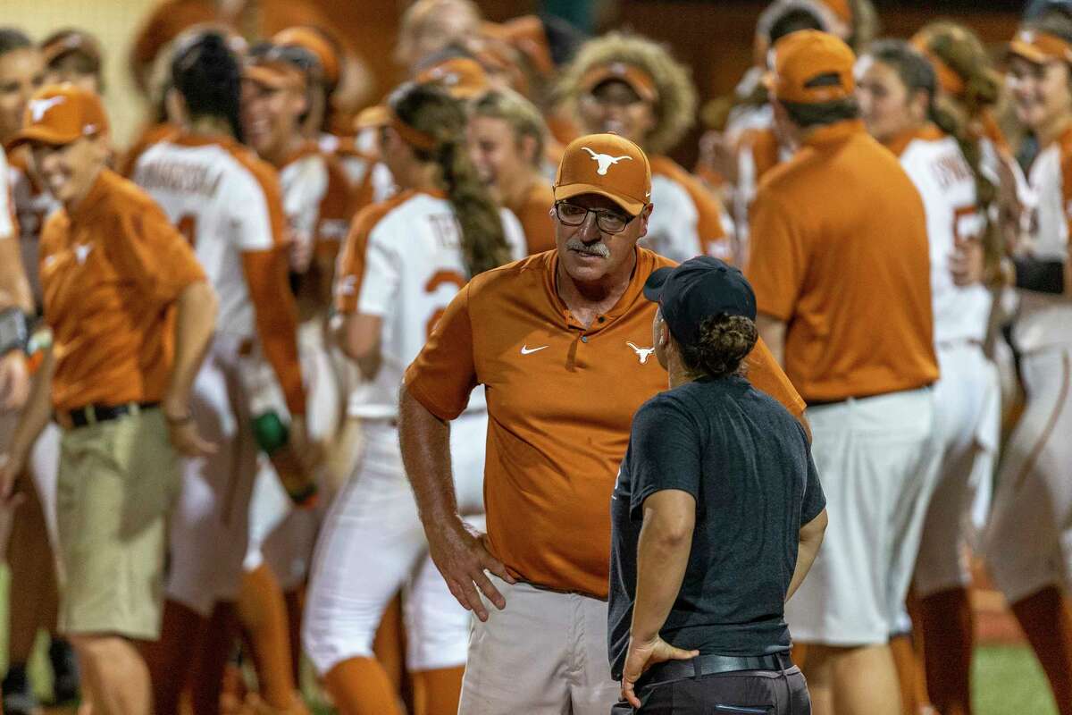 Texas head coach Mike White speaks with Houston head coach Kristin Vesely after Texas won 7-0 during an NCAA college softball tournament Austin Regional game, Sunday, May 19, 2019.