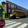 Buses lining up in front of Columbus Magnet School Friday afternoon,, April 23, ,2021, in Norwalk, Conn.