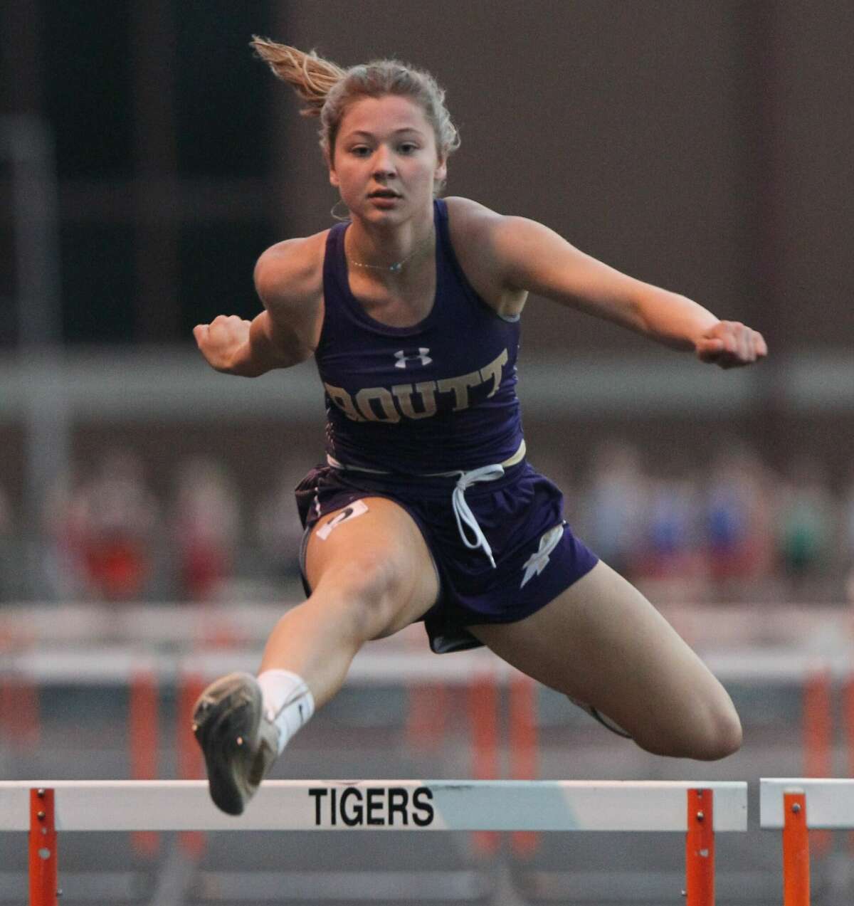 West Central's Emma Terwische clears the last hurdle in the 300-meter hurdles at the Beardstown Sectional Friday night. Terwische finished second to qualify for state in the event for the second straight year.