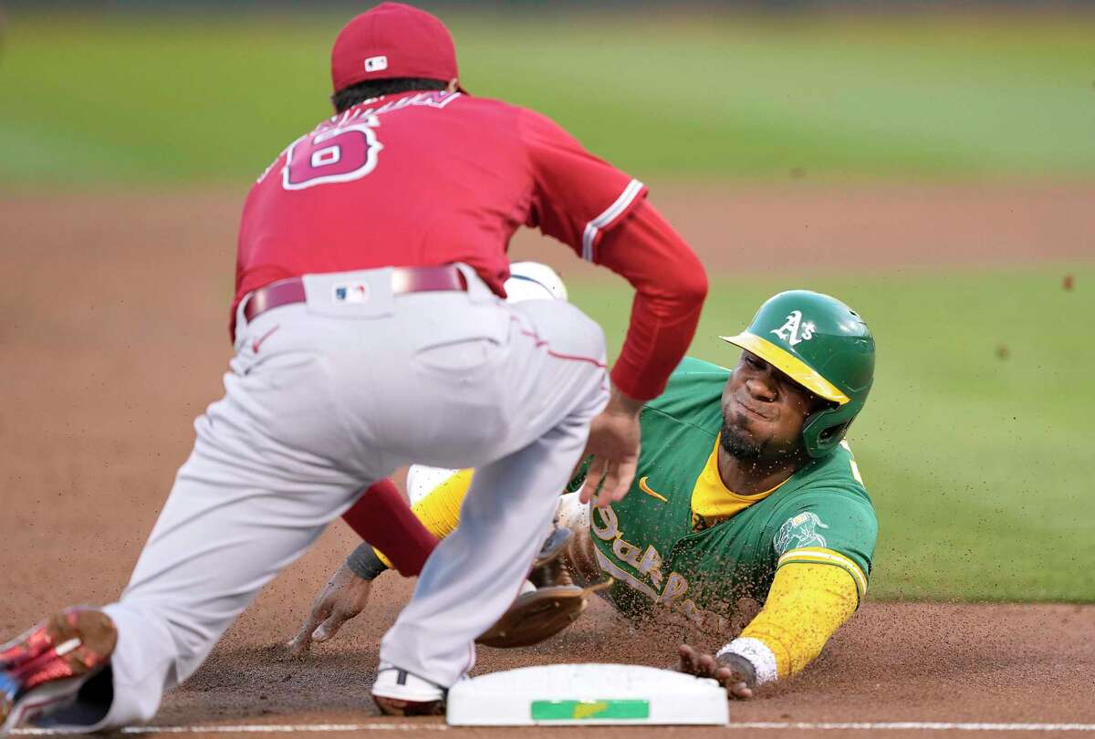 OAKLAND, CALIFORNIA - MAY 13: Elvis Andrus #17 of the Oakland Athletics gets tagged out at third base by Anthony Rendon #6 of the Los Angeles Angels in the bottom of the third inning at RingCentral Coliseum on May 13, 2022 in Oakland, California. (Photo by Thearon W. Henderson/Getty Images)