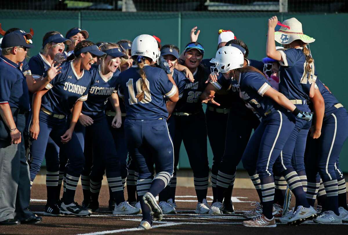 O’Connor Ella Gonzales (10) is greeted by teammates after she connects on a two run HR in the first inning in a 6A Regional IV quarterfinals High School Softball where O'Connor defeated Brenann 12-3 at Northside Field on Friday, May 13, 2022.