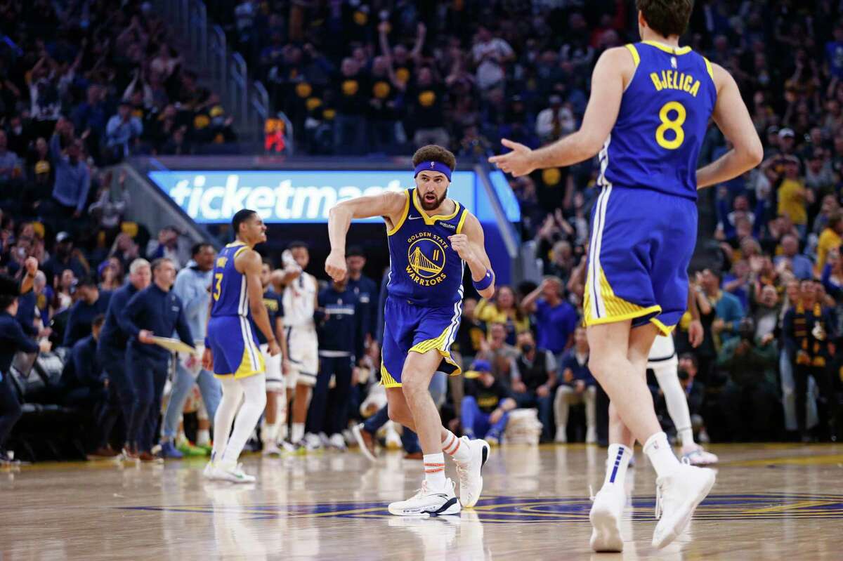 Golden State Warriors guard Klay Thompson (11) punches the air after scoring a three-point shot against the Memphis Grizzlies in the first quarter of Game 6 of the Western Conference Semifinals at Chase Center, Friday, May 13, 2022, in San Francisco, Calif.