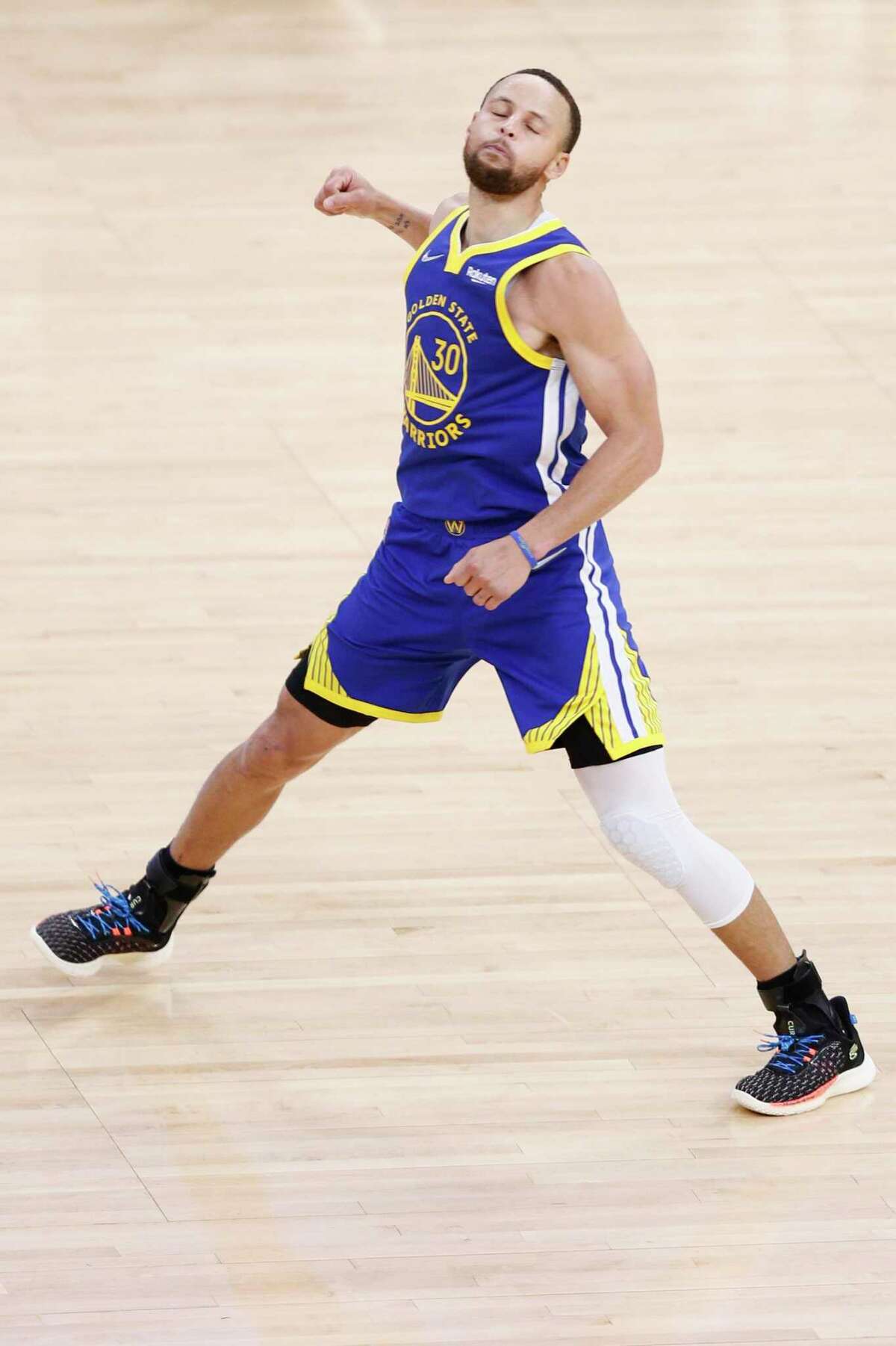 Golden State Warriors guard Stephen Curry (30) celebrates his three-point shot late in the fourth quarter against the Memphis Grizzlies in Game 6 of the Western Conference Semifinals at Chase Center, Friday, May 13, 2022, in San Francisco, Calif. The Warriors won 110-96 in the game and 4-2 in the series to advance to the conference finals.