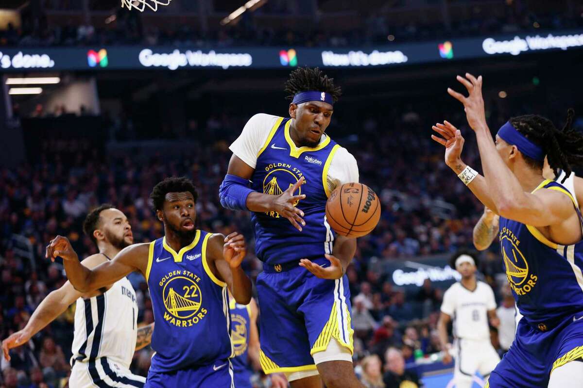 Golden State Warriors center Kevon Looney (5) and the Warriors go for the loose ball against the Memphis Grizzlies in the first quarter of Game 6 of the Western Conference Semifinals at Chase Center, Friday, May 13, 2022, in San Francisco, Calif.