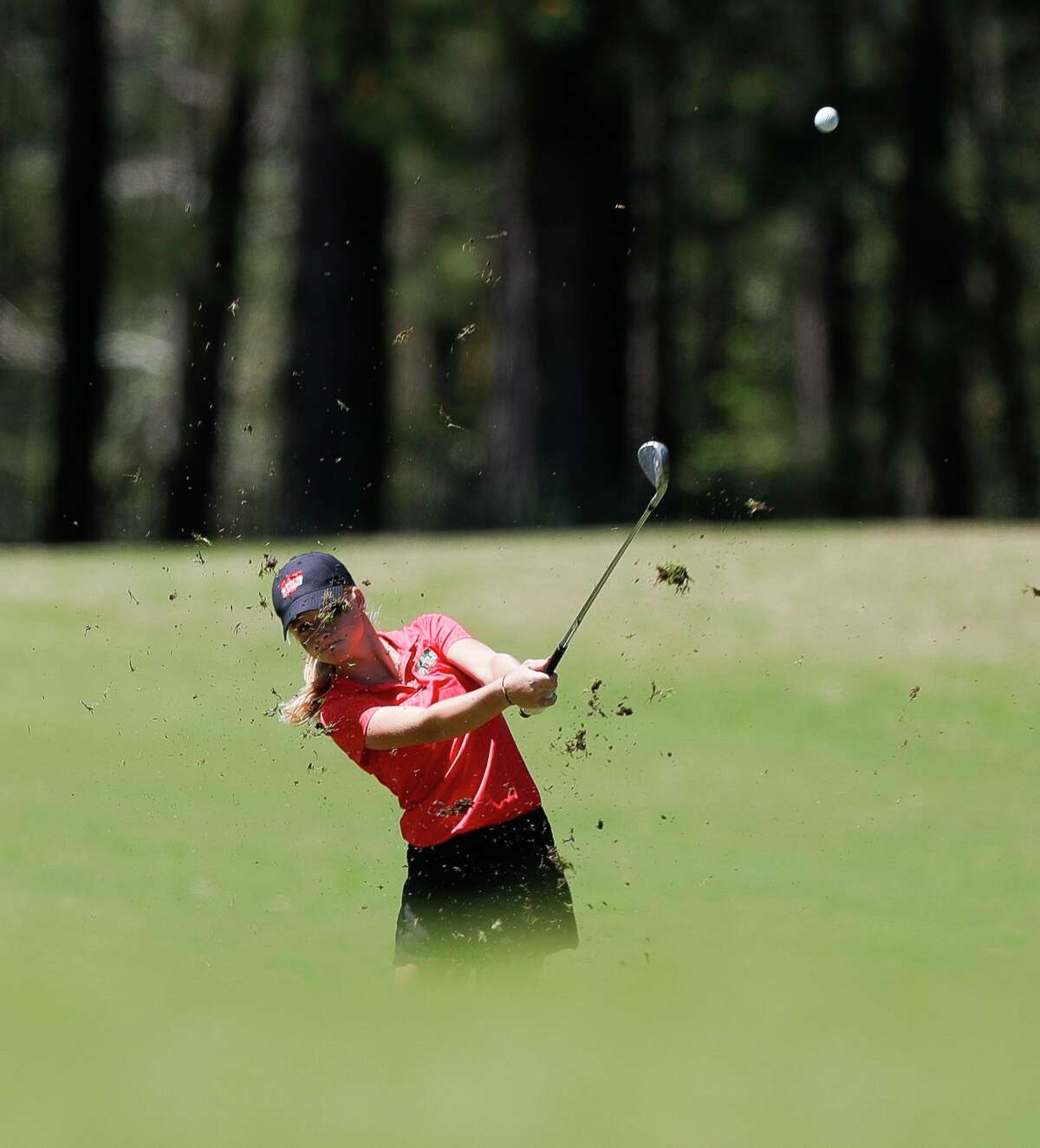 Charlotte Stick of The Woodlands hits toward the sixth green during the District 13-6A golf championships, Wednesday, March 30, 2022, in Magnolia.